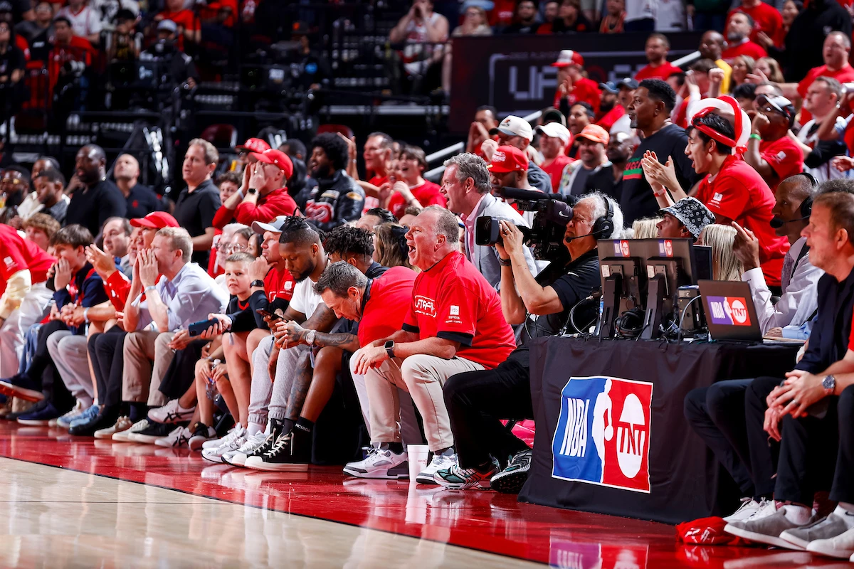 Crowd cheering courtside during a playoff game