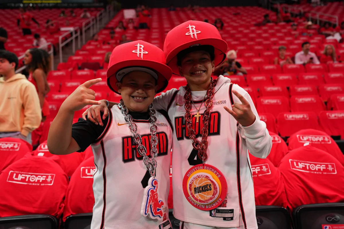 Crowd cheering and standing in the stands during a playoff game