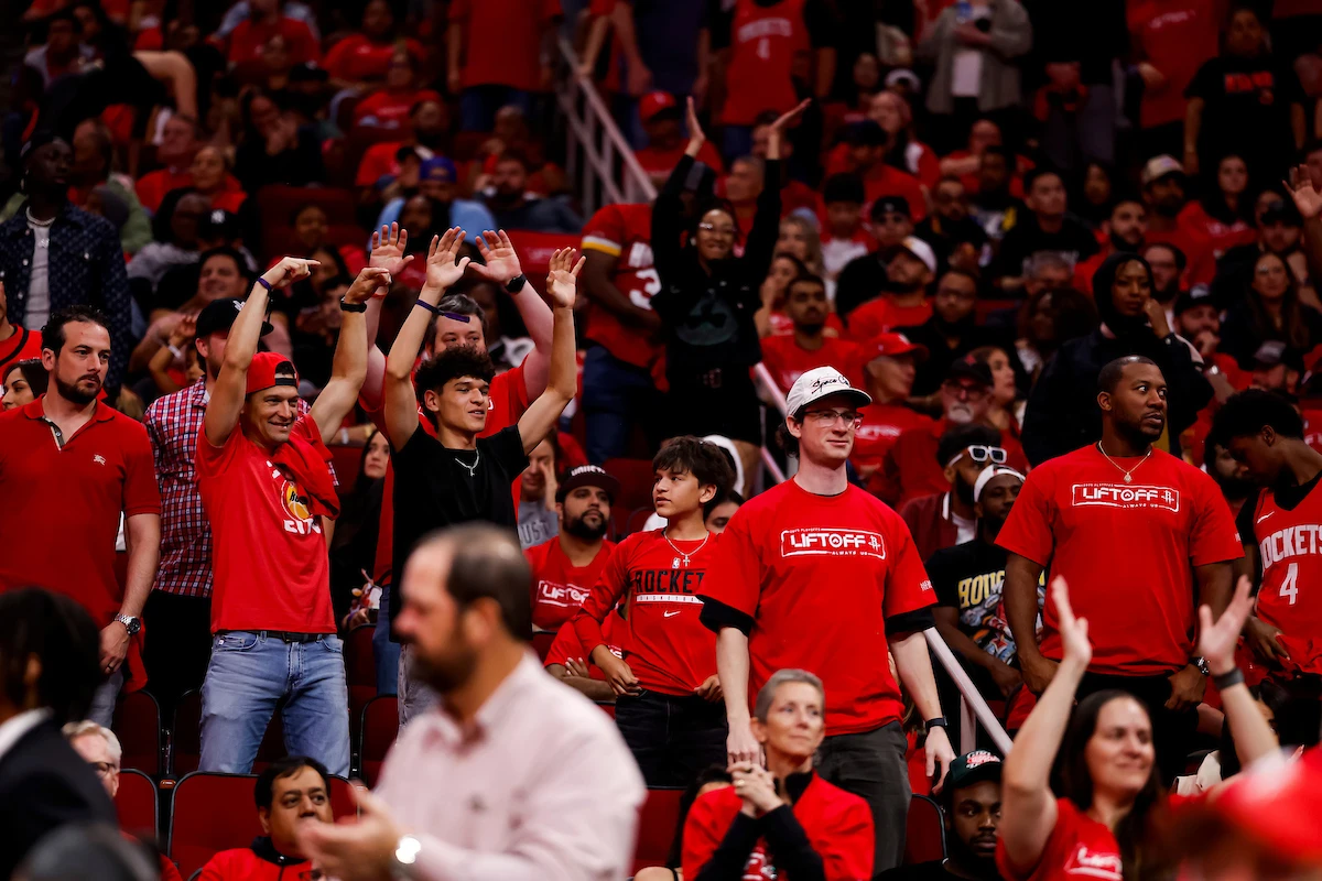 Crowd cheering sitting in the stands during a playoff game